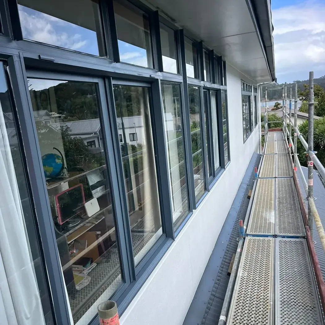 Resprayed aluminium window joinery on an Auckland home