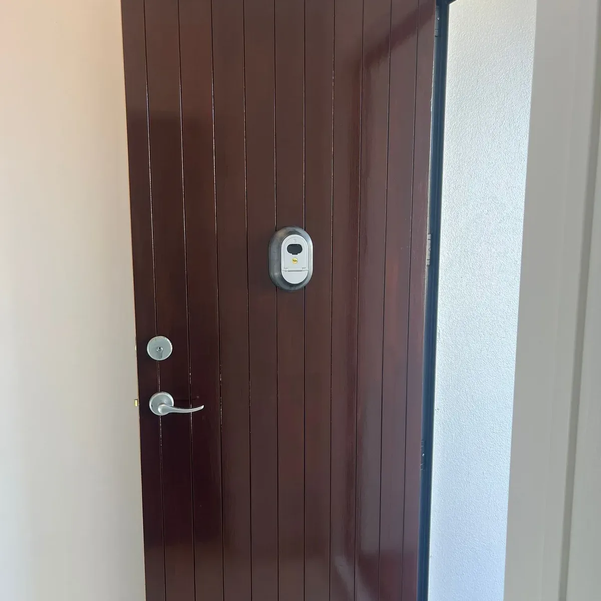 Timber entry door finished with a rich dark stain